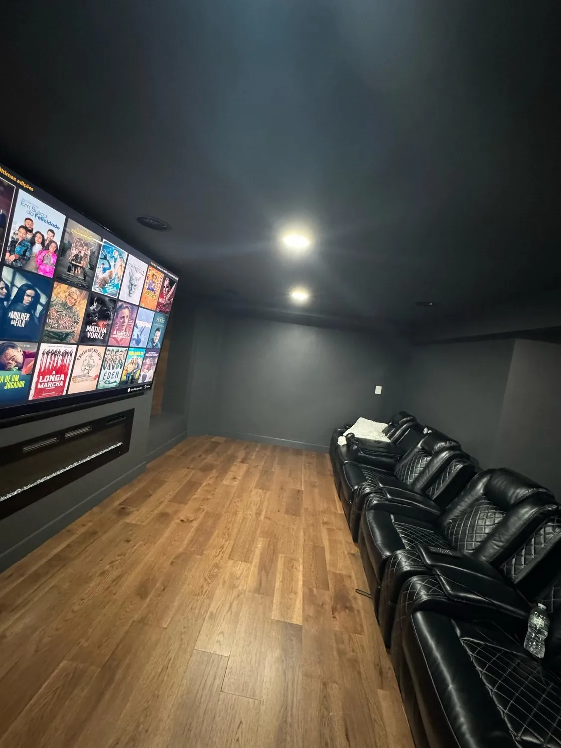A Leominster home cinema room in charcoal with a large screen and recessed lighting